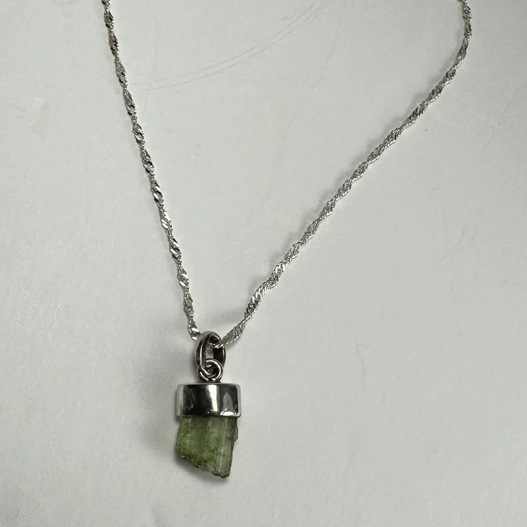 Stunning tourmaline pendant in silver bezel with twisted chain