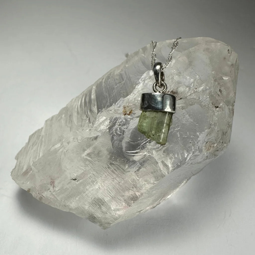 Stunning greenish tourmaline pendant in sterling silver bezel