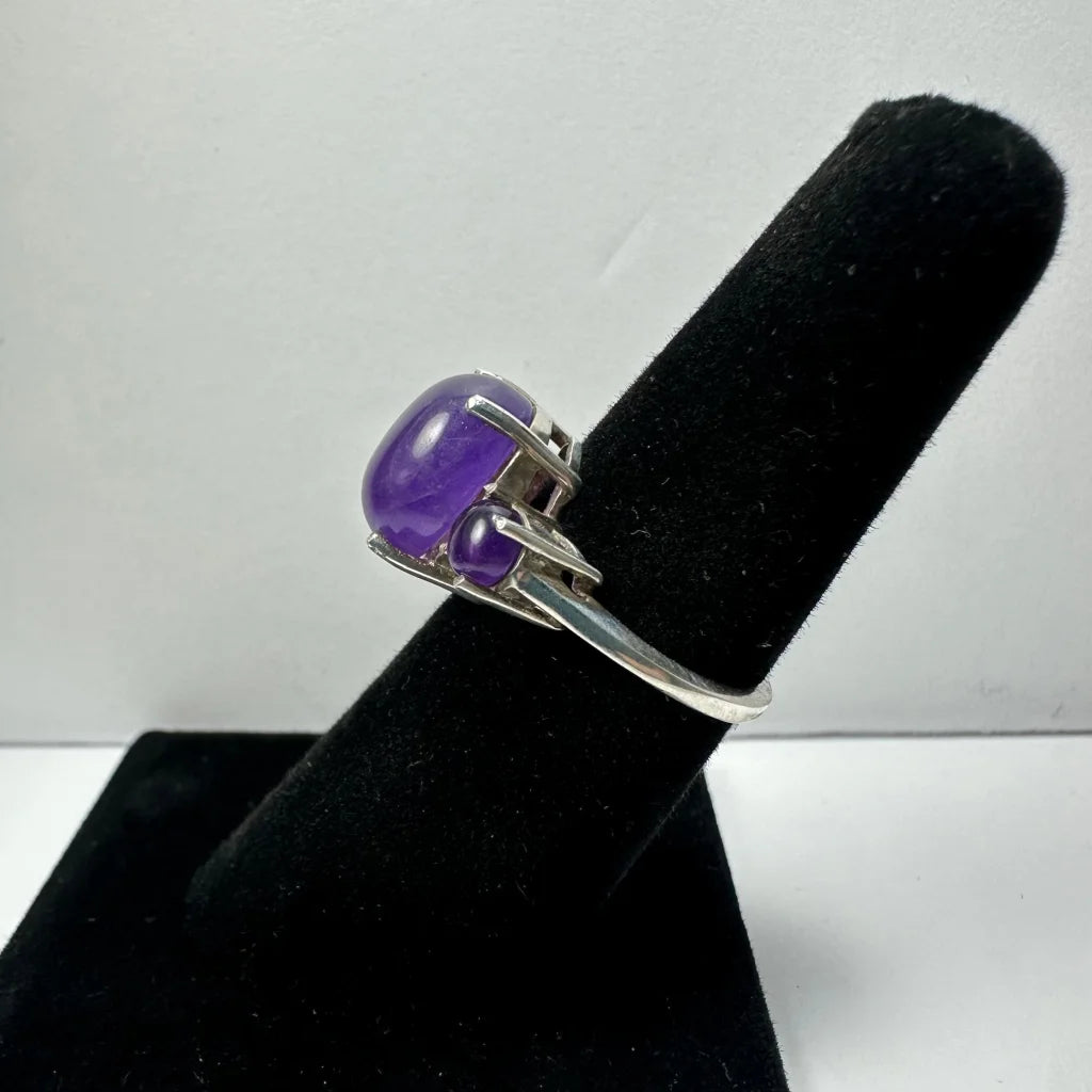 Stunning silver amethyst ring with oval purple gem and accent stone