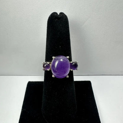 Stunning silver amethyst ring with oval purple stone and two rounds