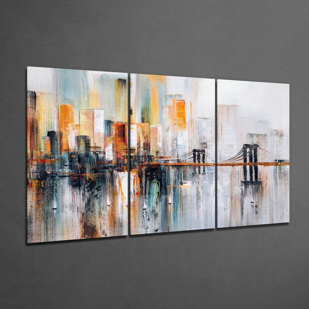 Stunning glass wall art triptych with urban bridge cityscape in orange, blue, gray