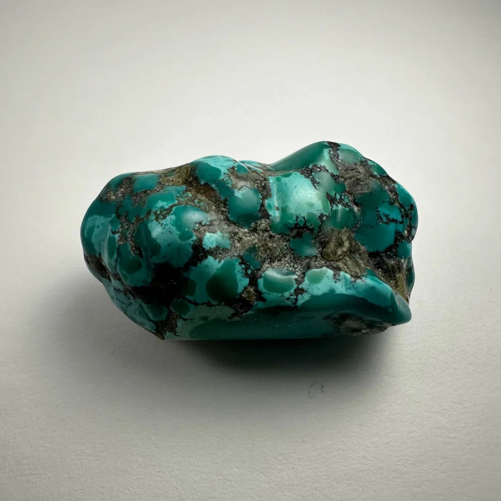 Vibrant turquoise nugget from Southwestern United States with glossy surface