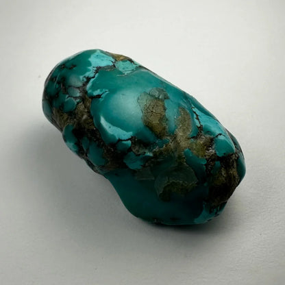 Vibrant turquoise nugget with golden veining from Southwestern United States