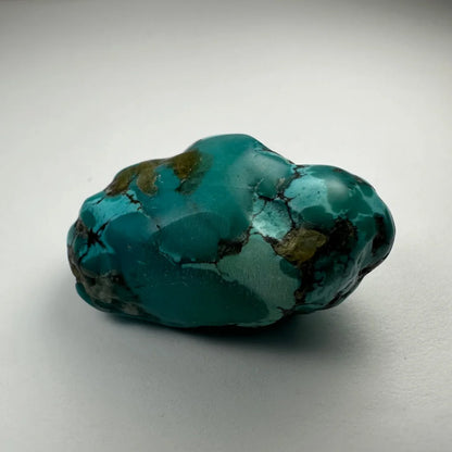 Vibrant turquoise nugget from Southwestern United States with matrix patterns