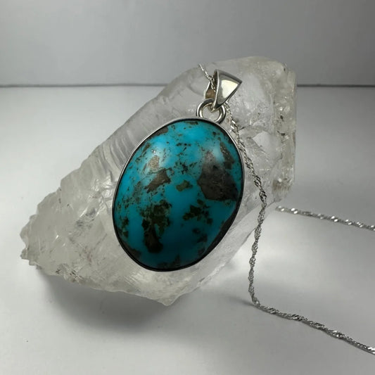 Stunning turquoise pendant in sterling silver with dark matrix inlay