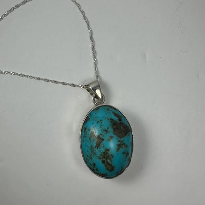 Stunning turquoise pendant in sterling silver with brown veining