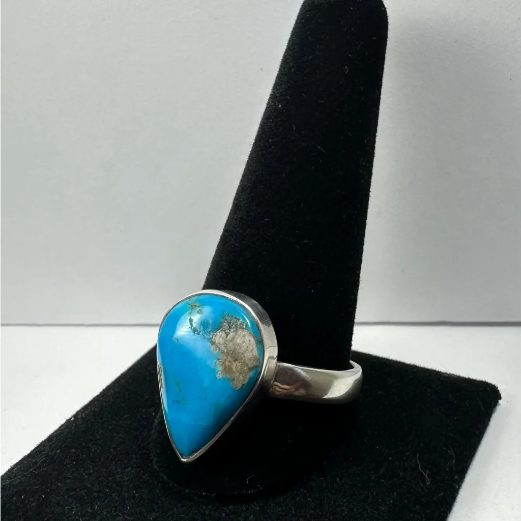 Vibrant turquoise ring in sterling silver with natural matrix patterns