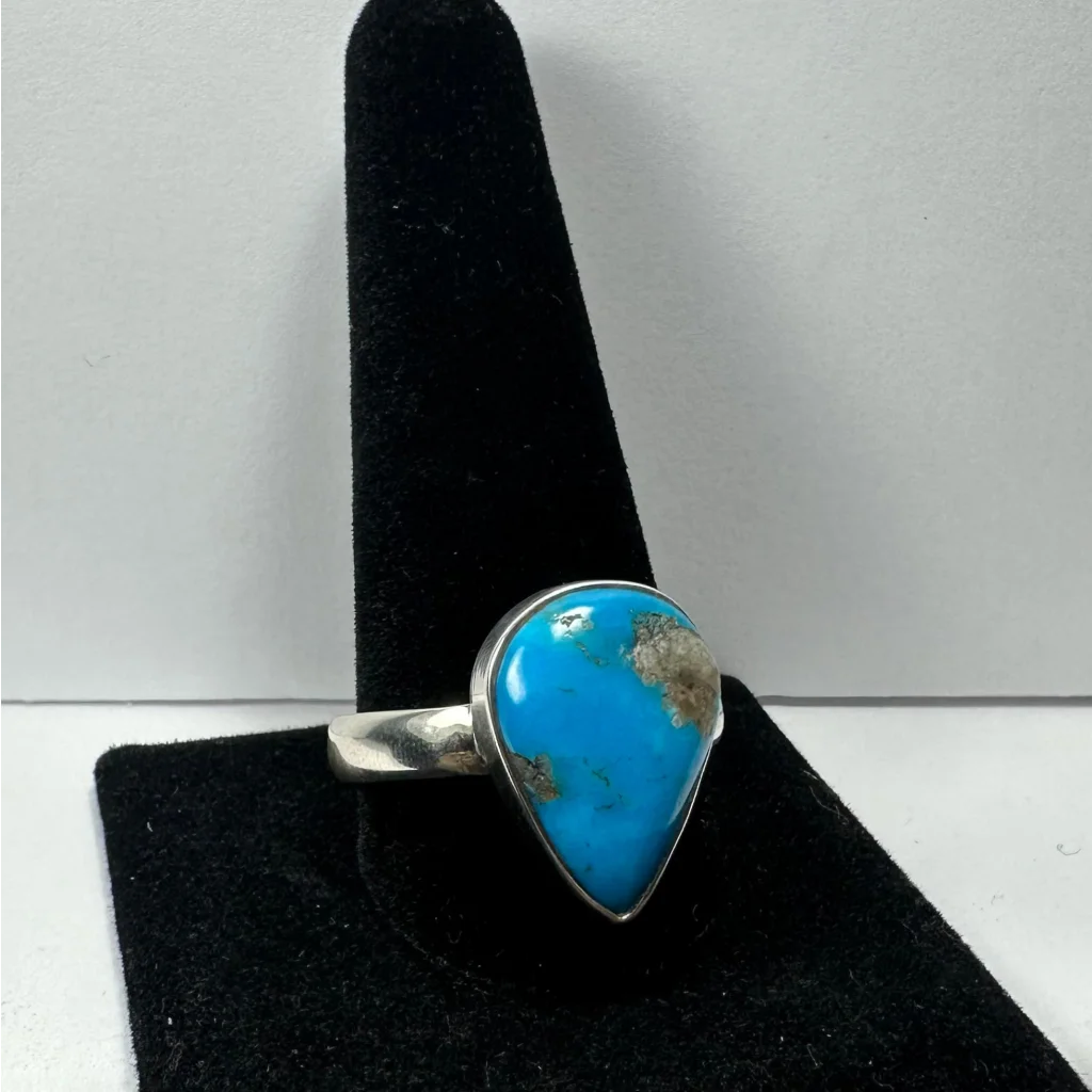 Vibrant turquoise ring in sterling silver with natural matrix patterns