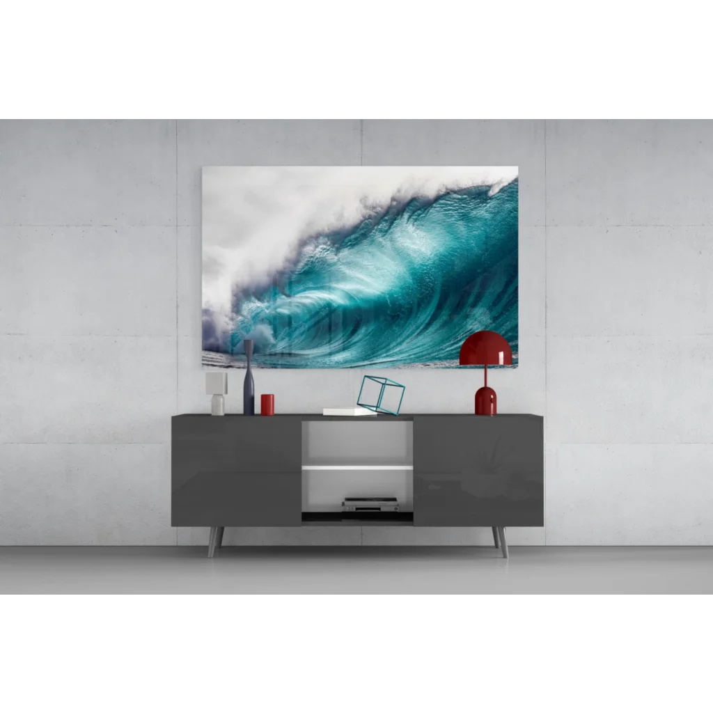 Vibrant turquoise ocean wave glass wall art on gray console