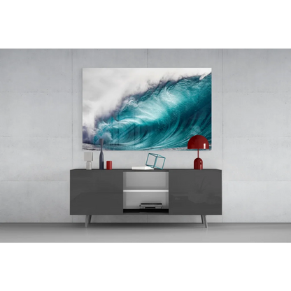 Vibrant turquoise ocean wave glass wall art on gray console