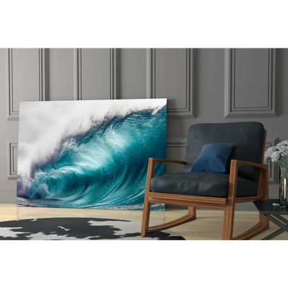Vibrant turquoise ocean wave glass wall art leaning on gray paneled wall