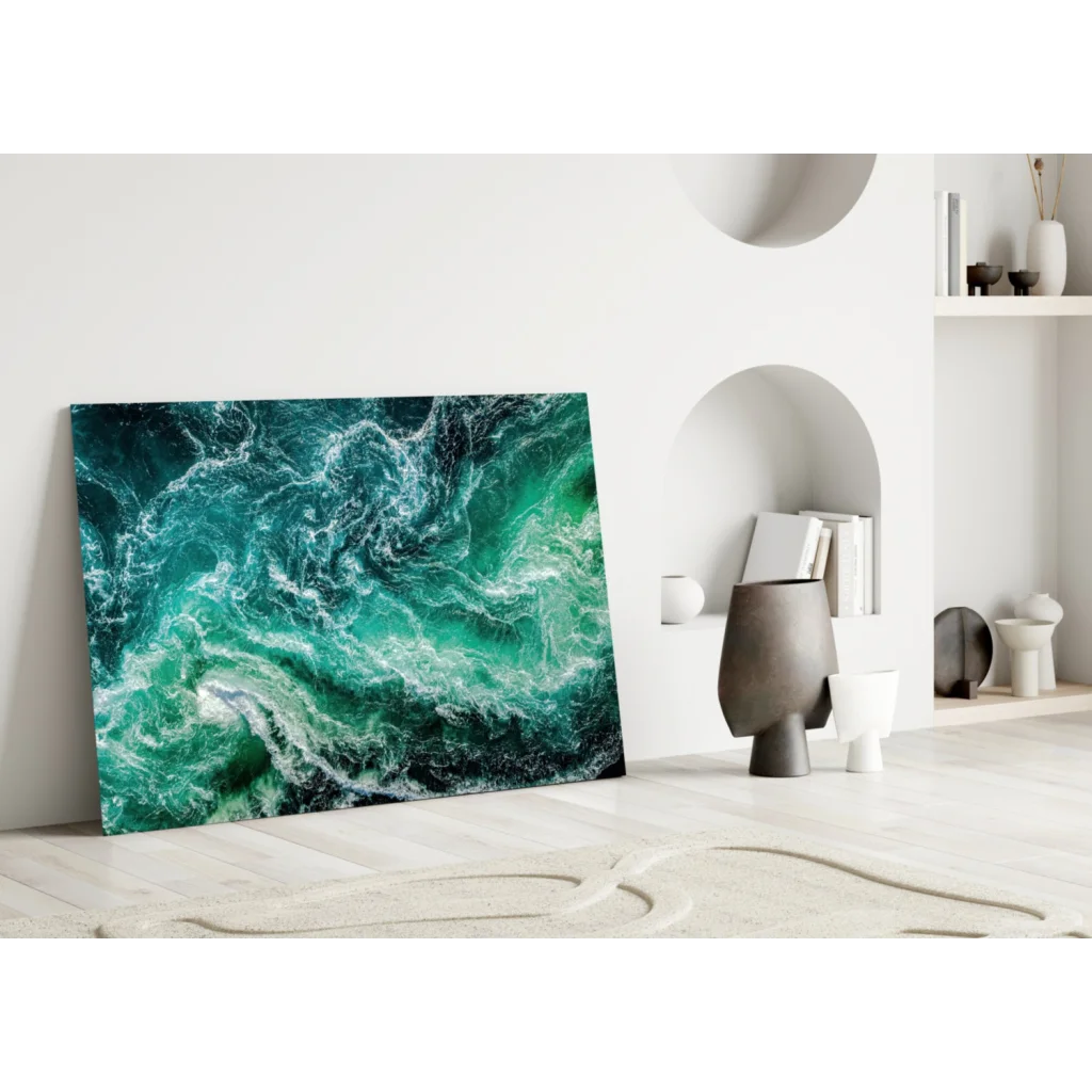 Vibrant teal turquoise wave glass wall art leaning on white wall