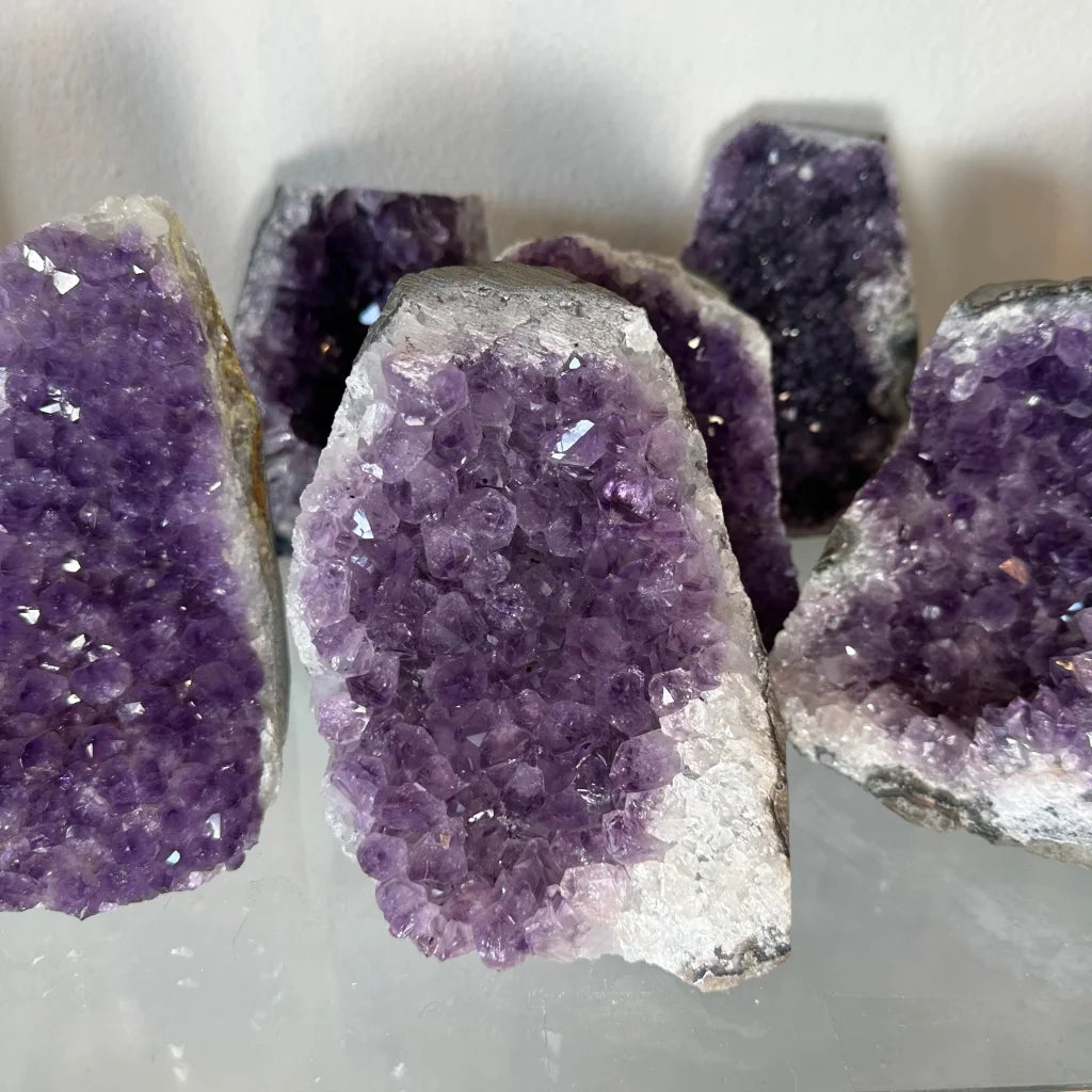 Stunning Uruguay amethyst geode with cut base and purple crystals