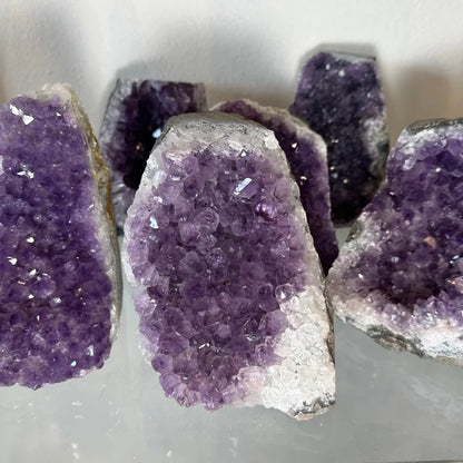 Stunning Uruguay amethyst geode with cut base and purple crystals