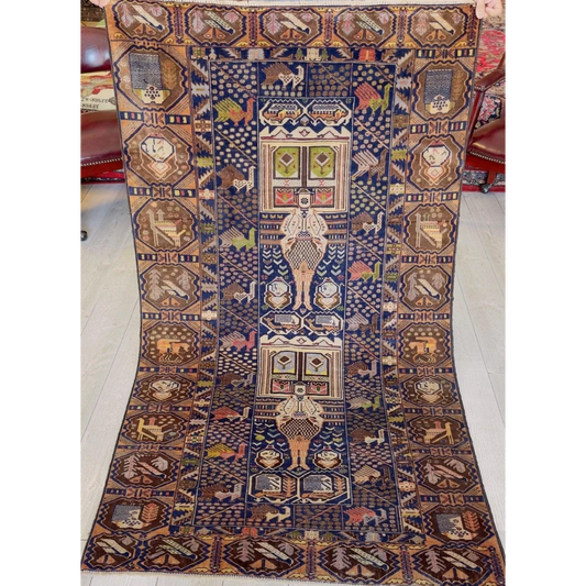 Vintage Baluchi Afghani rugs with intricate geometric tribal motifs