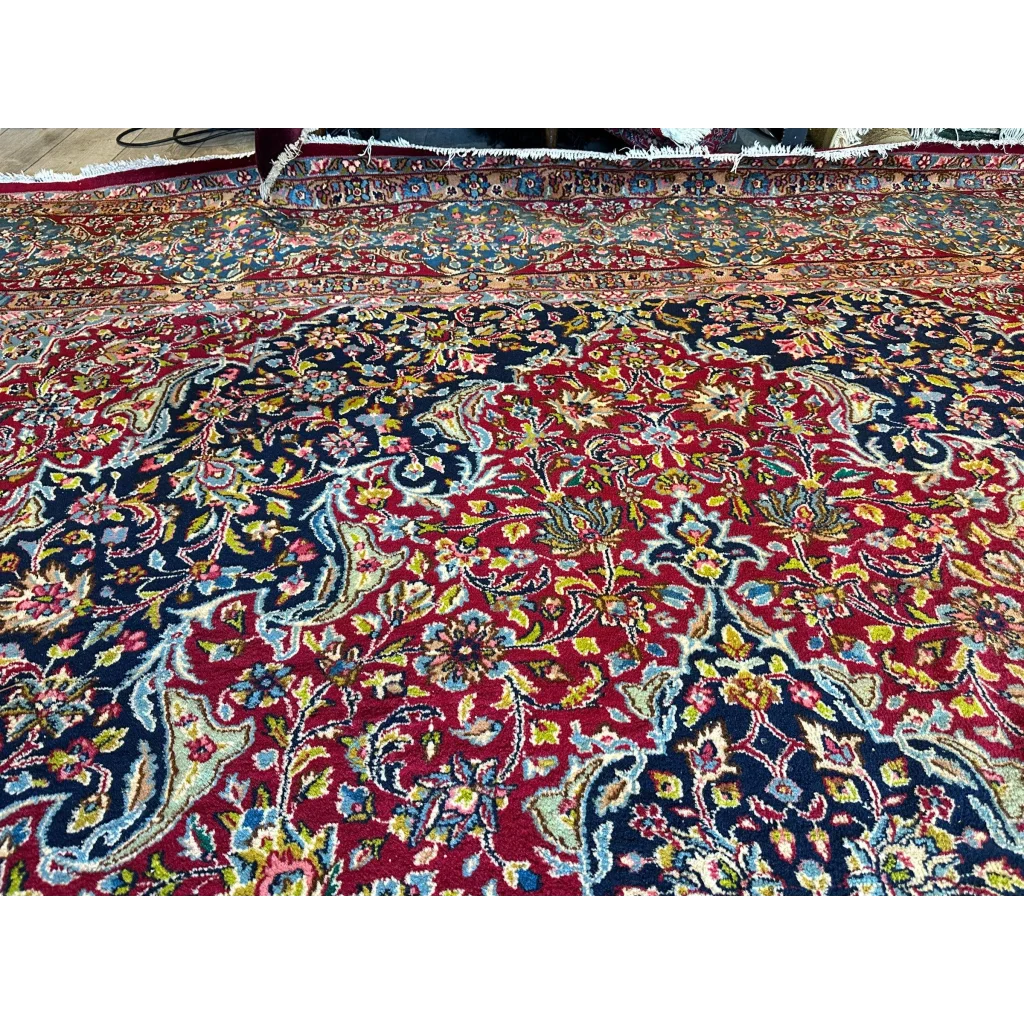 Vibrant vintage fine Persian rug with red navy medallion floral design