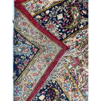 Vintage Kirman Persian rug with floral medallion in blues, pinks, golds