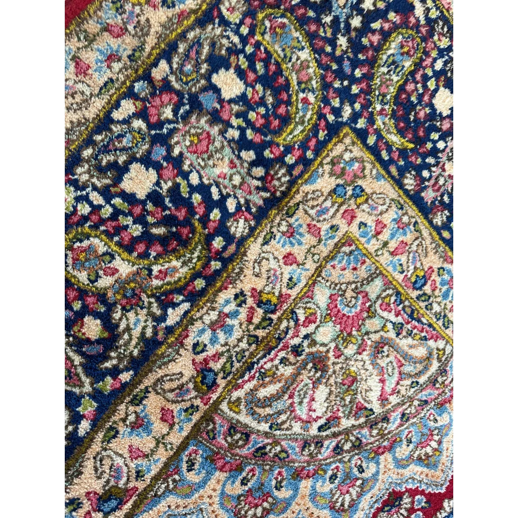 Stunning vintage Kirman Persian rug with navy paisley floral design