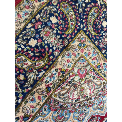 Stunning vintage Kirman Persian rug with navy paisley floral design