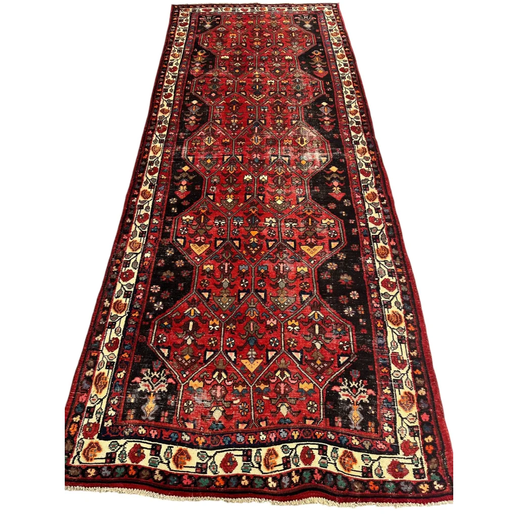 Vintage Persian Hosseinabad runner rug with red brown field and floral borders