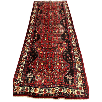 Vintage Persian Hosseinabad runner rug with red brown field and floral borders
