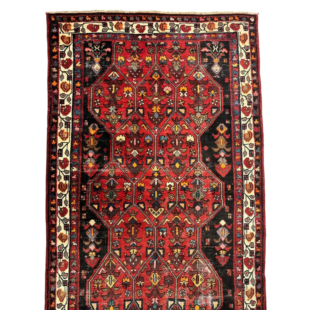 Vibrant vintage Persian Hosseinabad runner with red black geometric patterns