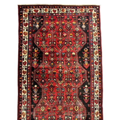 Vibrant vintage Persian Hosseinabad runner with red black geometric patterns