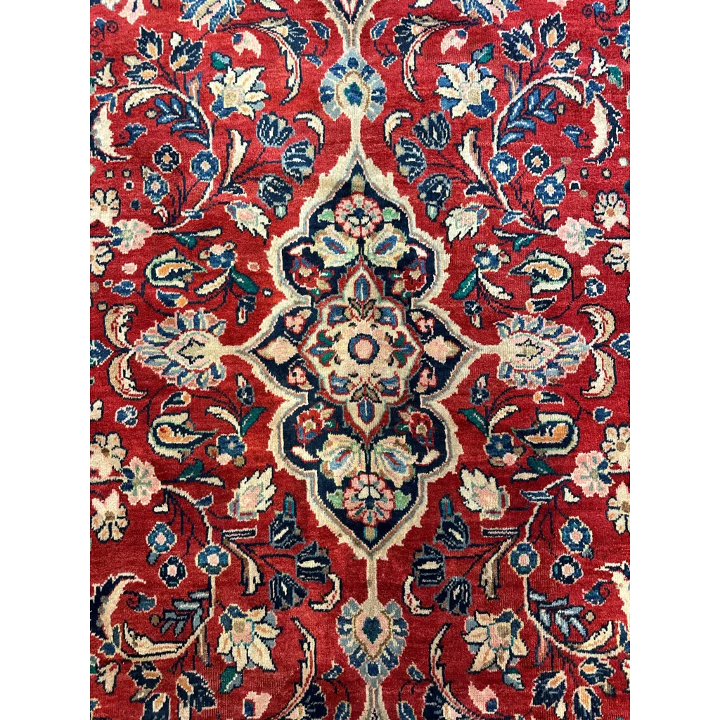 Vibrant red Persian Mahal rug with floral patterns in blue and green