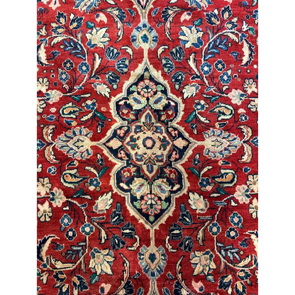 Vibrant red Persian Mahal rug with floral patterns in blue and green