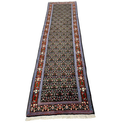 Vintage 1960s Persian Senneh runner rug with vibrant floral motifs