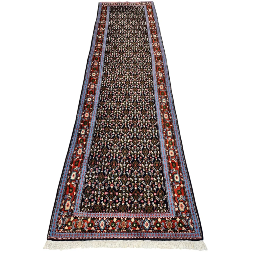 Vintage 1960s Persian Senneh runner rug with dark field and intricate patterns