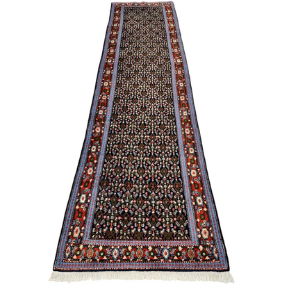 Vintage 1960s Persian Senneh runner rug with dark field and intricate patterns