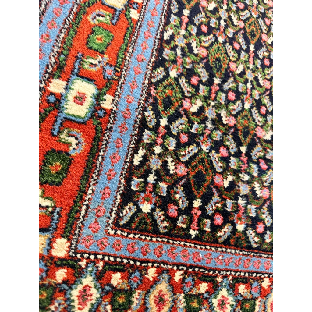 Vibrant 1960s Persian Senneh runner rug with intricate floral patterns