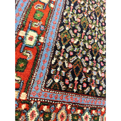 Vibrant 1960s Persian Senneh runner rug with intricate floral patterns