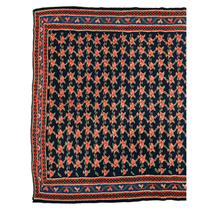Vintage 1950s Senneh runner showing coral rose garden pattern detail on dark navy field
