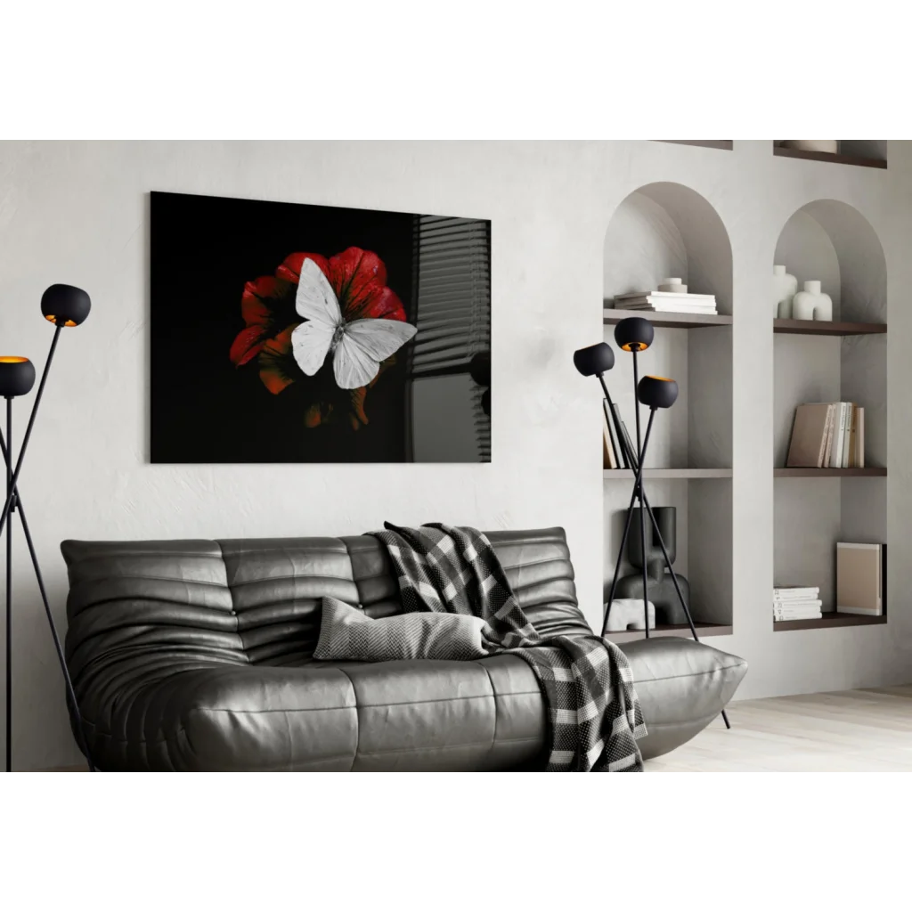 Black leather sofa under white butterfly red flower wall art print
