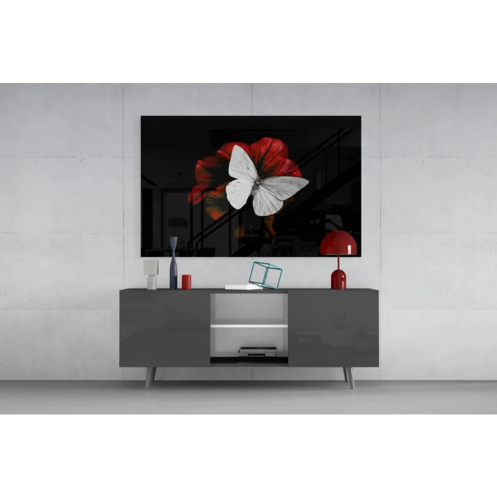 Gray TV stand with silver legs and glass doors under wall art print