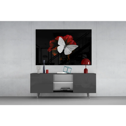 Gray TV stand with silver legs and glass doors under wall art print