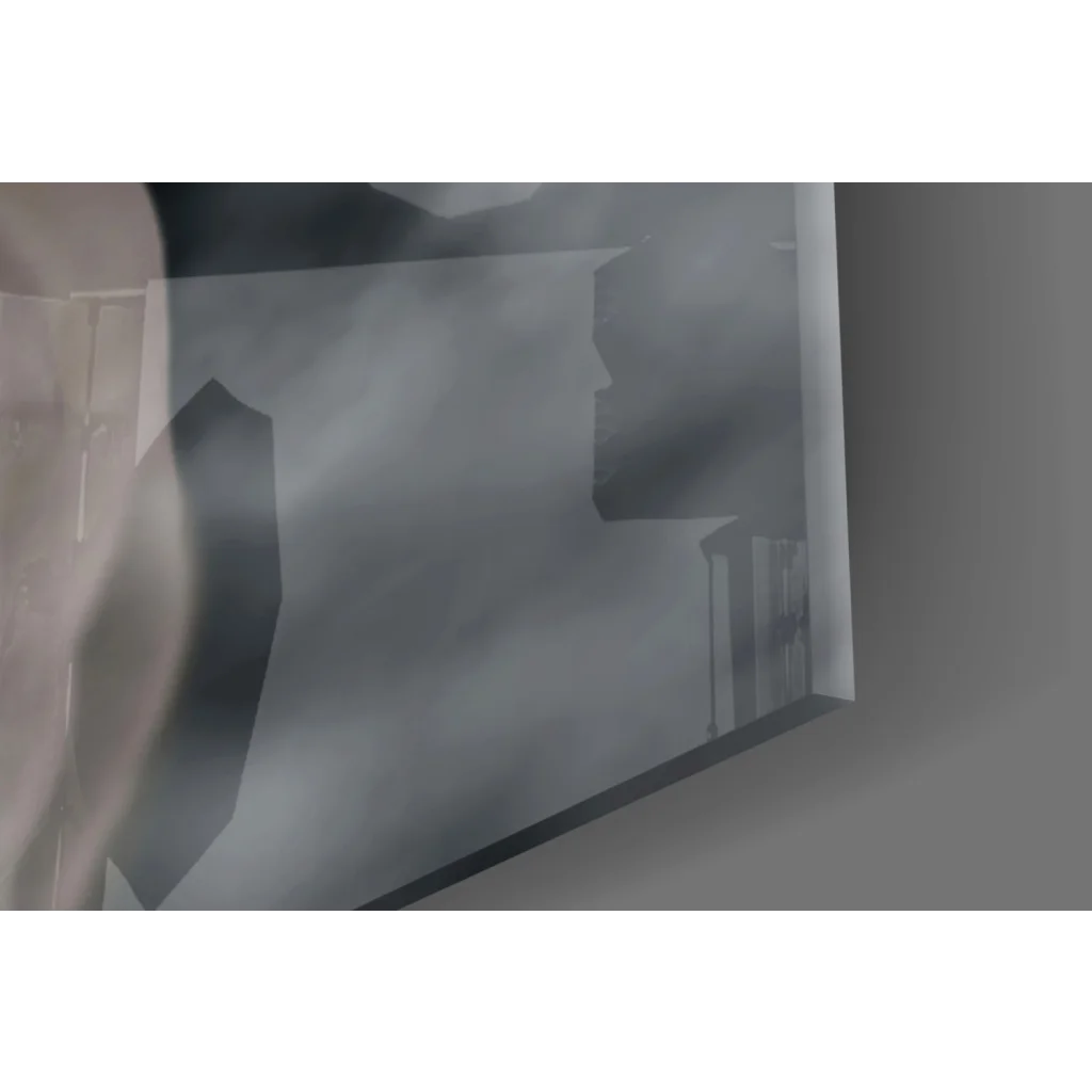 Sleek black-framed glass wall art mirror reflecting faint building silhouettes