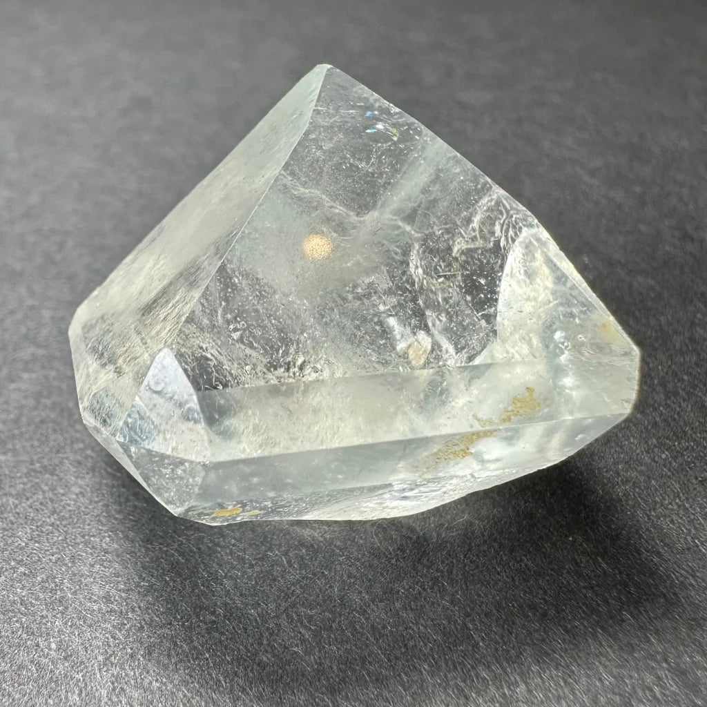Stunning white topaz crystal from Namibia with golden glow