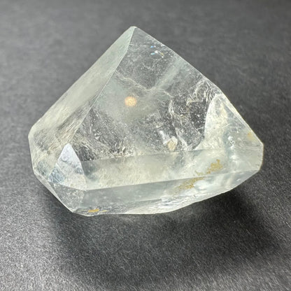 Stunning white topaz crystal from Namibia with golden glow