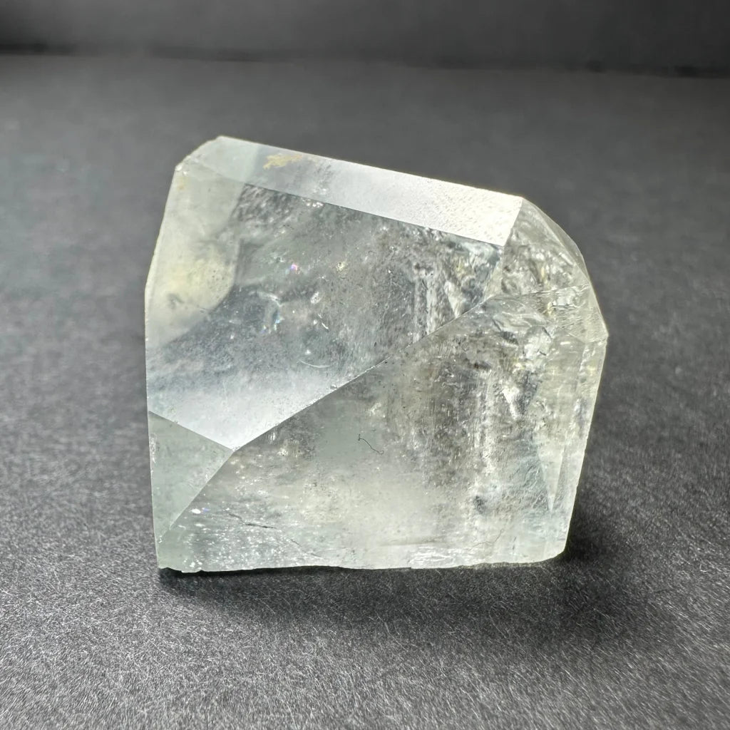 Stunning white topaz crystal from Namibia with golden glow