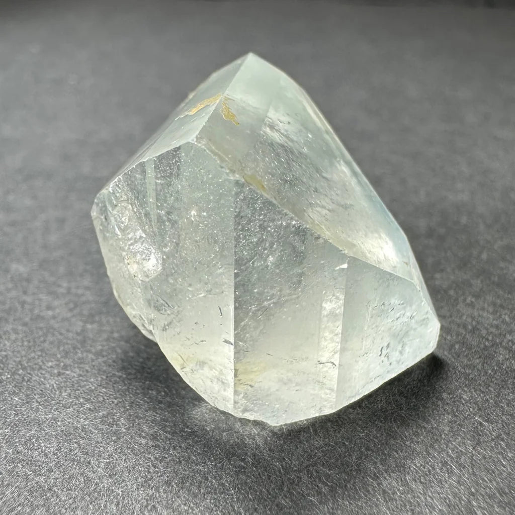 Stunning white topaz crystal from Namibia with golden glow