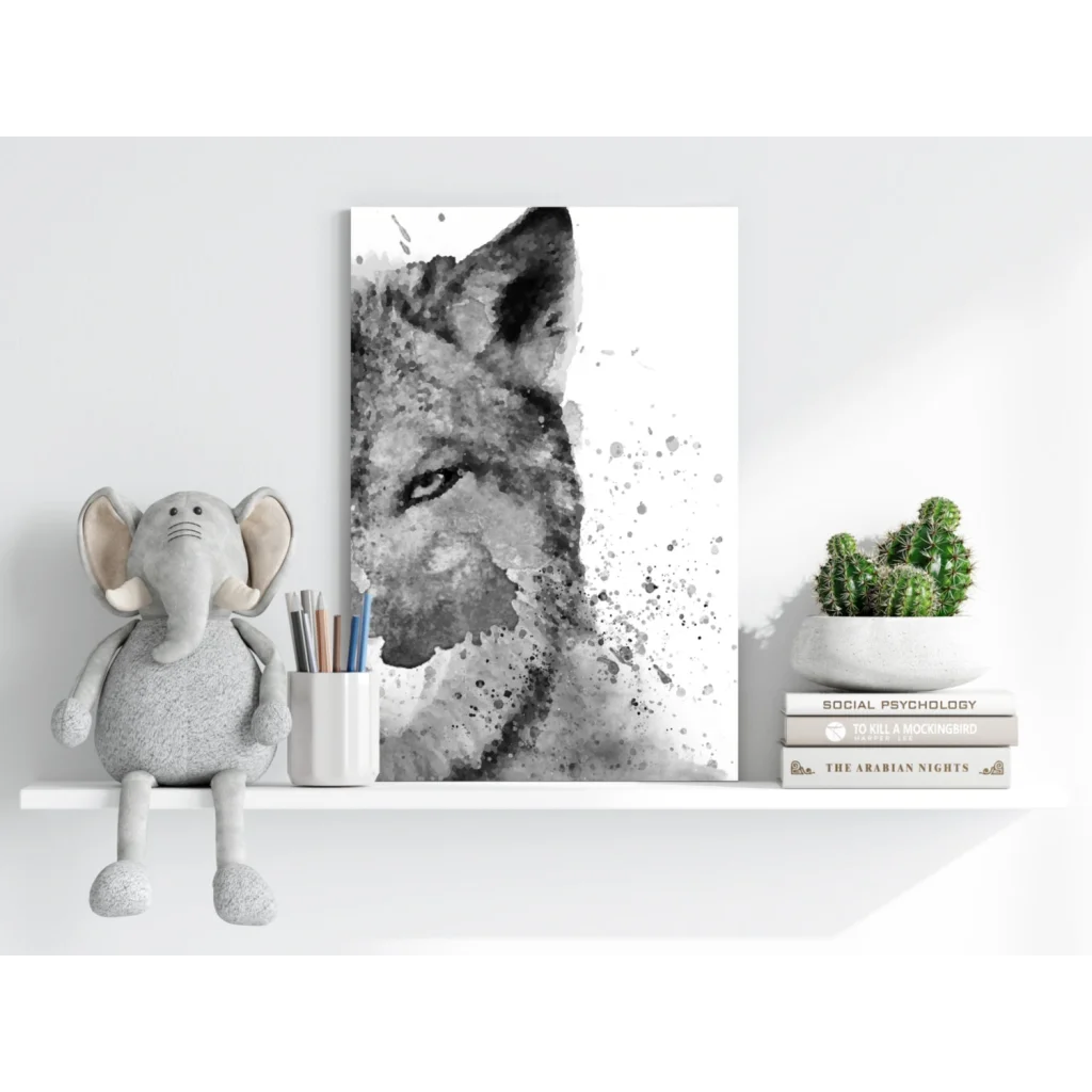 Gray plush elephant toy with floppy ears on white shelf