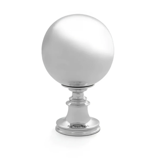 Polished silver wunderkammer globe finial on pedestal adds art vibe to any space