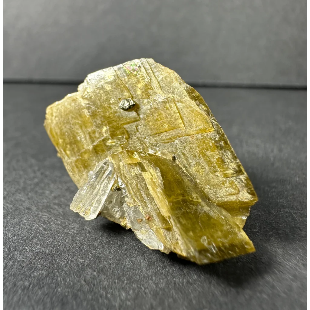 Stunning translucent yellow-green diamond quartz crystal with metallic inclusion