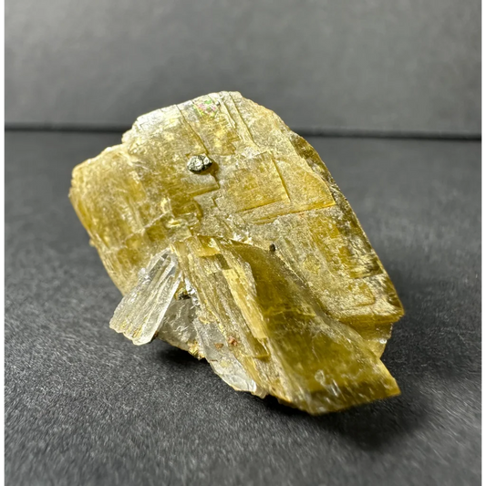 Stunning translucent yellow-green diamond quartz crystal with metallic inclusion
