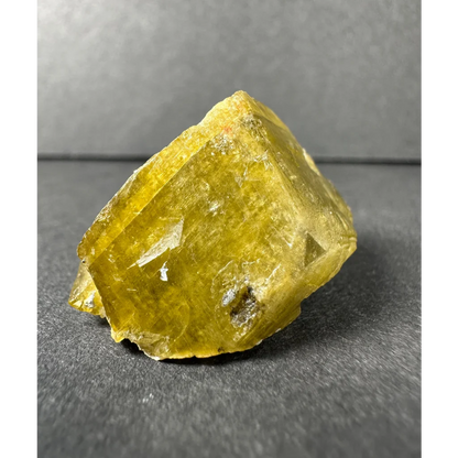 Stunning yellow diamond quartz crystal with translucent faceted surfaces