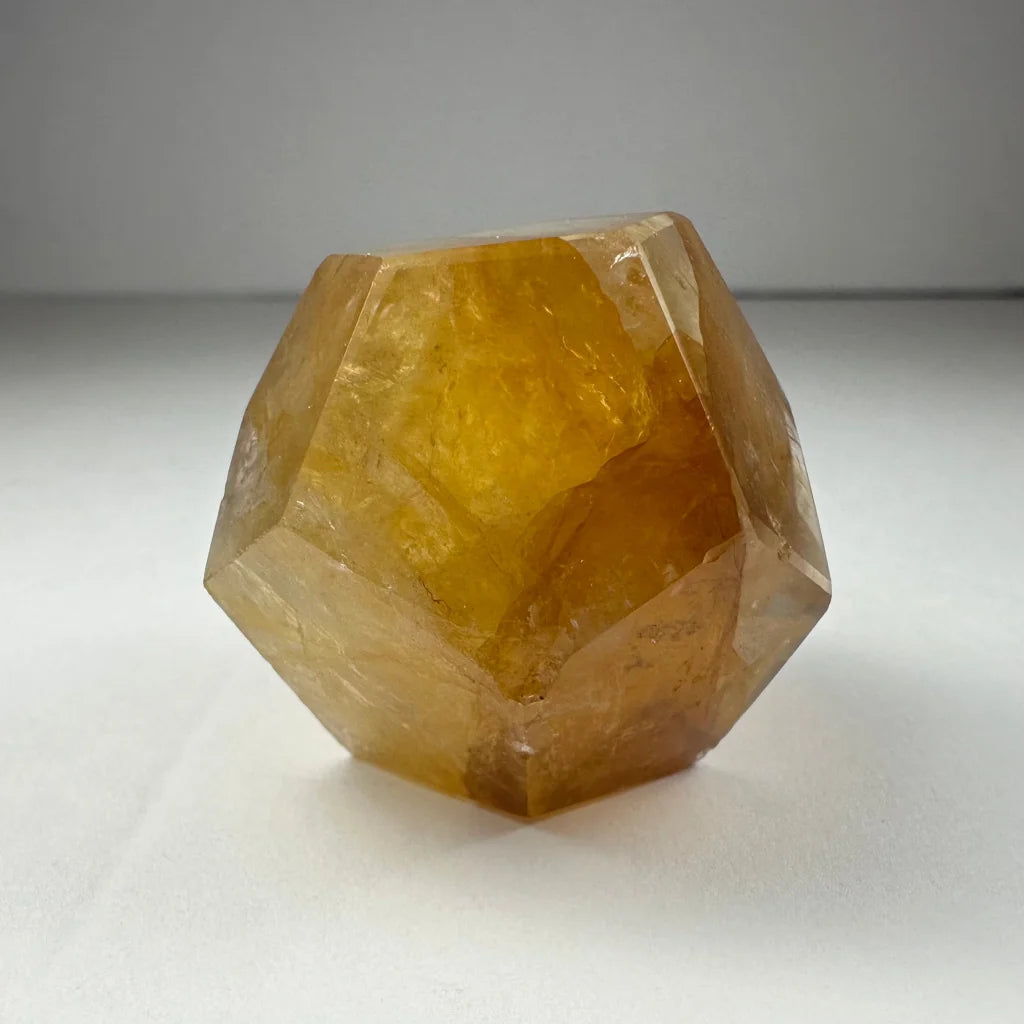 Stunning yellow hematoid quartz dodecahedron carving from Brazil