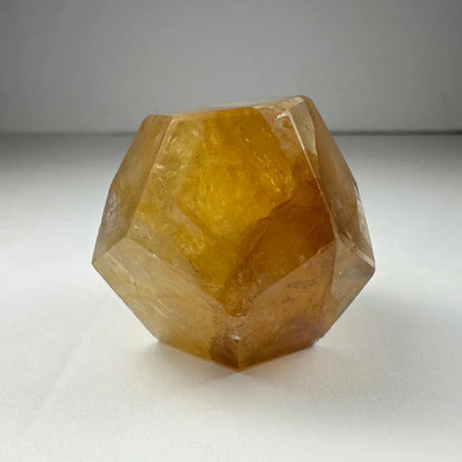 Stunning yellow hematoid quartz dodecahedron carving from Brazil